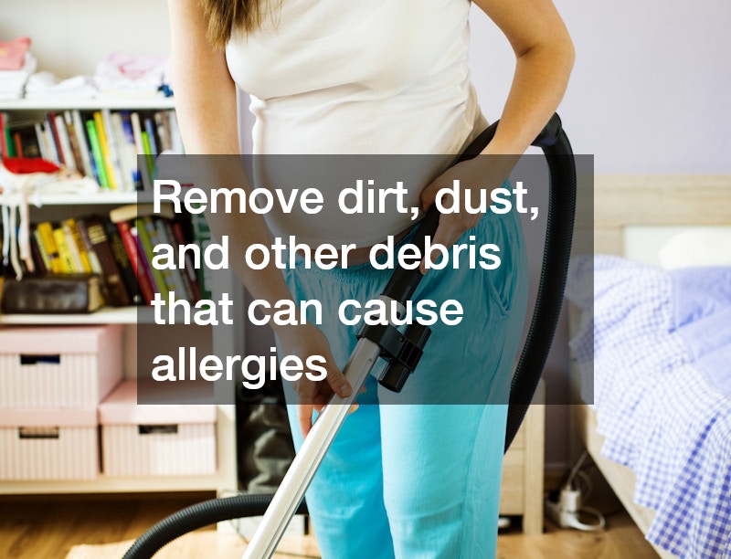 pregnant woman vacuuming the floor